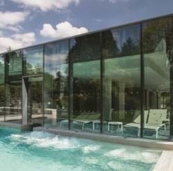 The bold lines of the glass covered section of the Roof Top Spa were planned by the Architect
